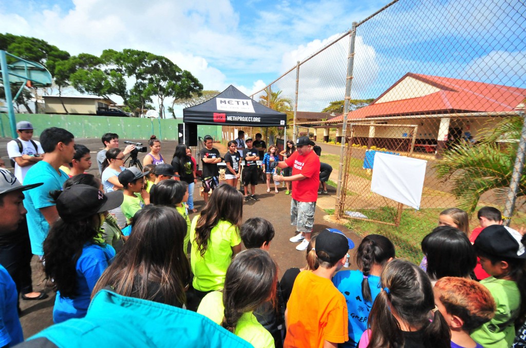 Middle and high school students from Kauai gather for a workshop on aerosol art, led by world-renowned artist, East3