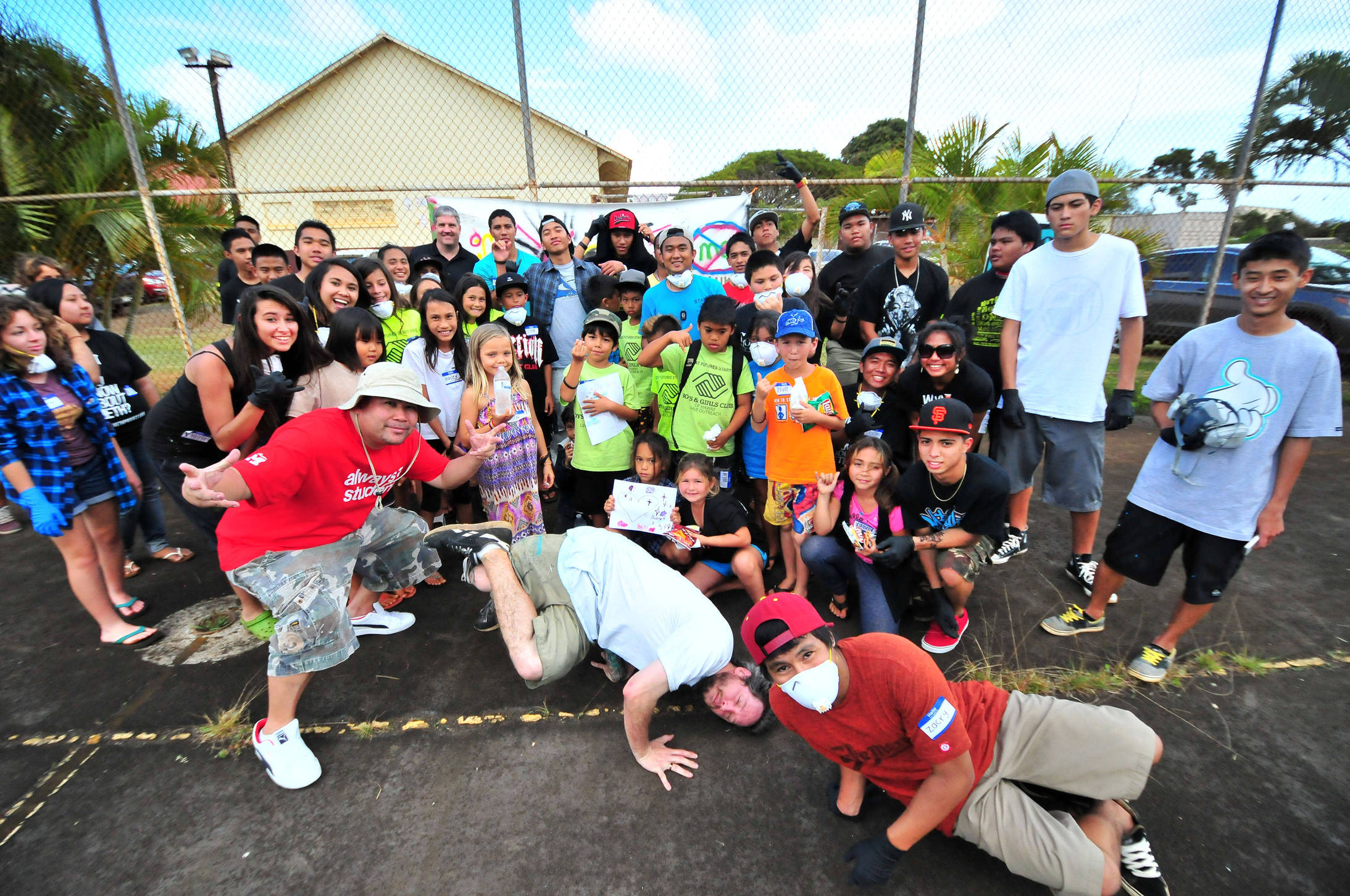 Kauai students pose with artist East3 after the completion of the first day of art workshops. Over 100 students from Kauai were registered to attend the Spray Away Meth art workshop series over the 2-day period. 