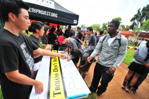 Mililani High School students sign a pledge advocating for meth prevention on their campus and in their community