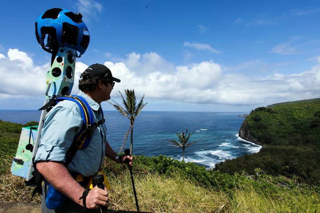 Rob Pacheco, President of Hawaii Forest & Trail, with the Street View Trekker takes in the view at Pololū Valley’s ‘ wini Trail