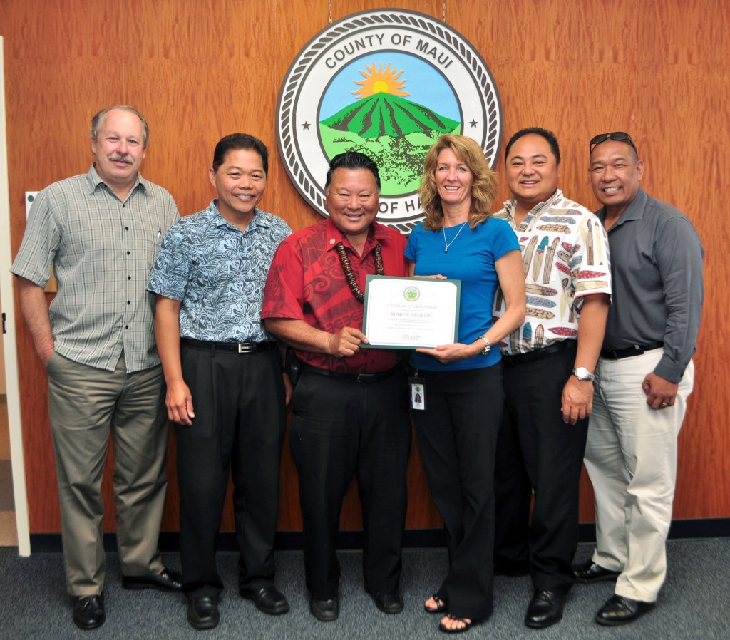 RPA Technical Officer Marcy Martin is recognized by Mayor Alan Arakawa and Finance Director Danny Agsalog (far right), Deputy Finance Director Mark Walker (far left), RPA Division Administrator Scott Teruya (second from right) and Gery Madriaga, Asst. Administrator, RPA Division (second from left). PHOTO:  County of Maui / Ryan Piros