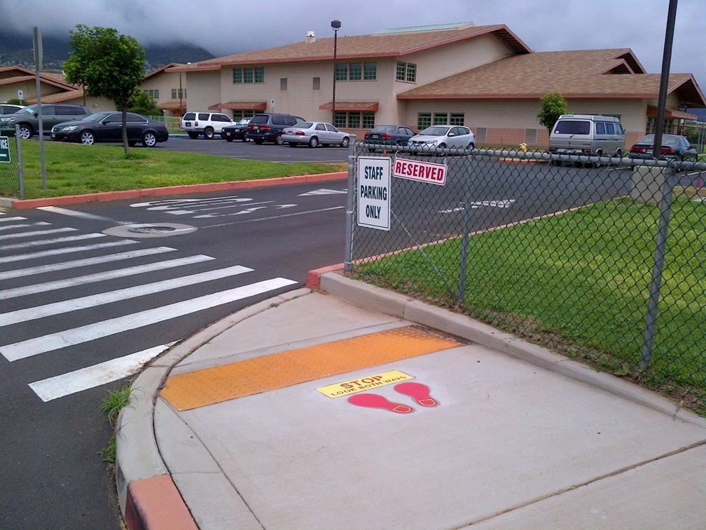 Ronald McDonald shoeprints placed at Pomaikai Elementary School reminding keiki and other pedestrians to be careful at school crossings. Photo courtesy: Grace Pacific Roadway Solutions 