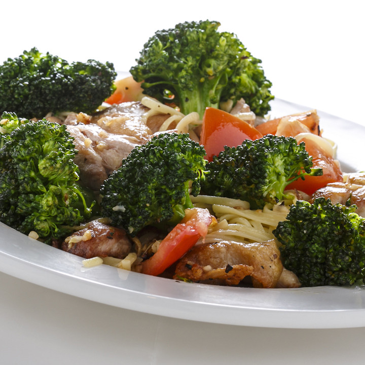 Chicken Broccoli Saute - Boneless chicken thighs sauteed lightly in olive oil and garlic, with fresh broccoli and tomato. Served over a bed of pasta.