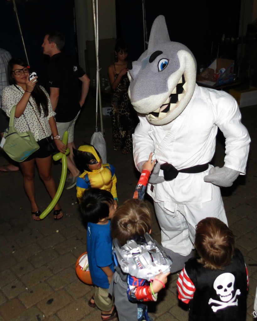 HPU mascot Sharky meets costume contest entrants at the Halloween FunFest.