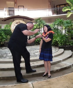 Mayor Bernard Carvalho, Jr. hands his new Managing Director Nadine Nakamura the keys to her office after she is sworn in. 