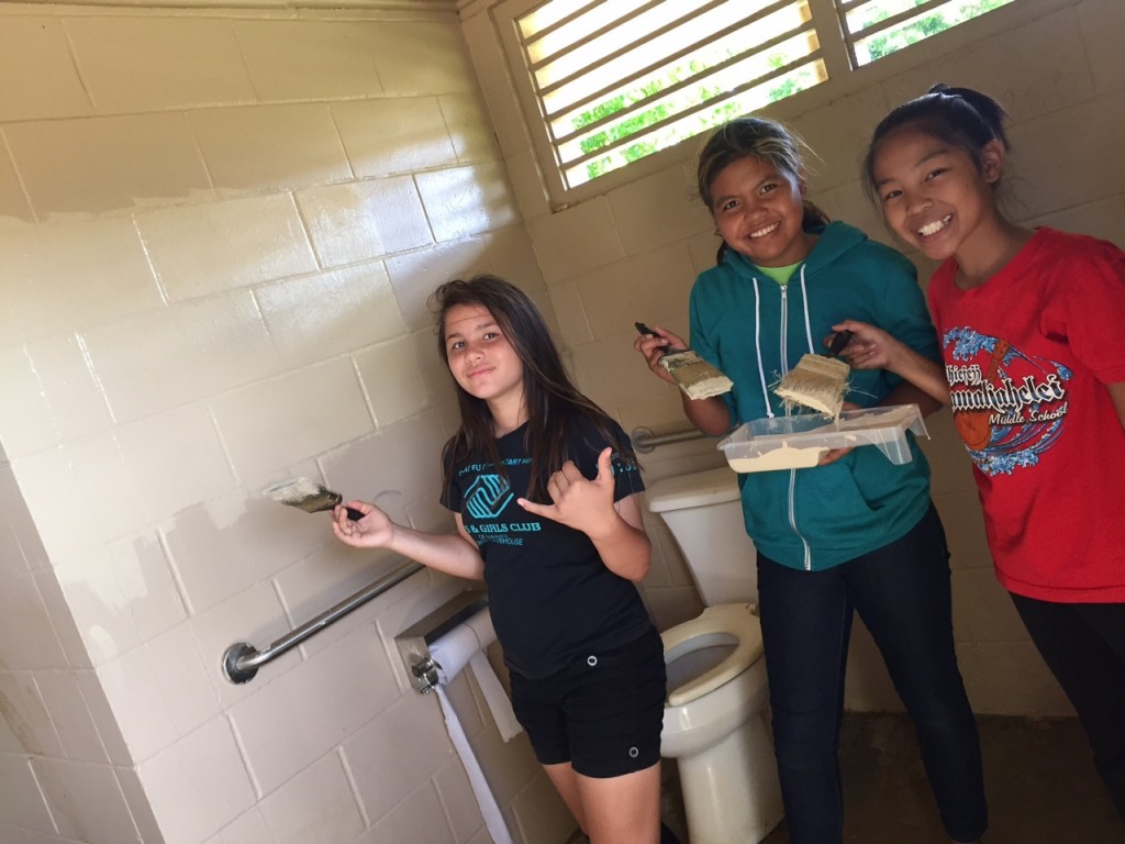 From Left to Right: Janelle, Deannalyn, and Ghiezelle. Approximately 20 members of the Boys and Girls of Hawai‘i and BGCH Youth Development Specialist Grace Peralta painted over graffiti Wednesday at the Puhi Regional Park. The mission of the BGCH is to inspire young people to become responsible citizens.
