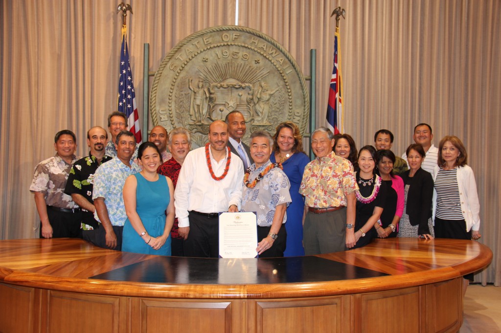 PHOTO  COURTESY OF THE GOVERNOR’S OFFICE: Representatives of federal, state and county agencies pose for a photo with Gov. David Ige (first row, second from right) following his signing of the Fair Housing Proclamation last week.